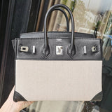 Side view of sleek structured handbag