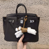 Side view of modern structured handbag