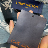 Side profile of Louis Vuitton luxury clothing with label-forward styling