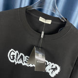 Close-up detail shot of Givenchy luxury clothing with monogram-inspired silhouette