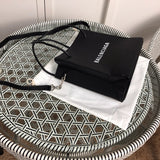 Styled lifestyle shot of modern chic women's handbag – women's luxury handbag