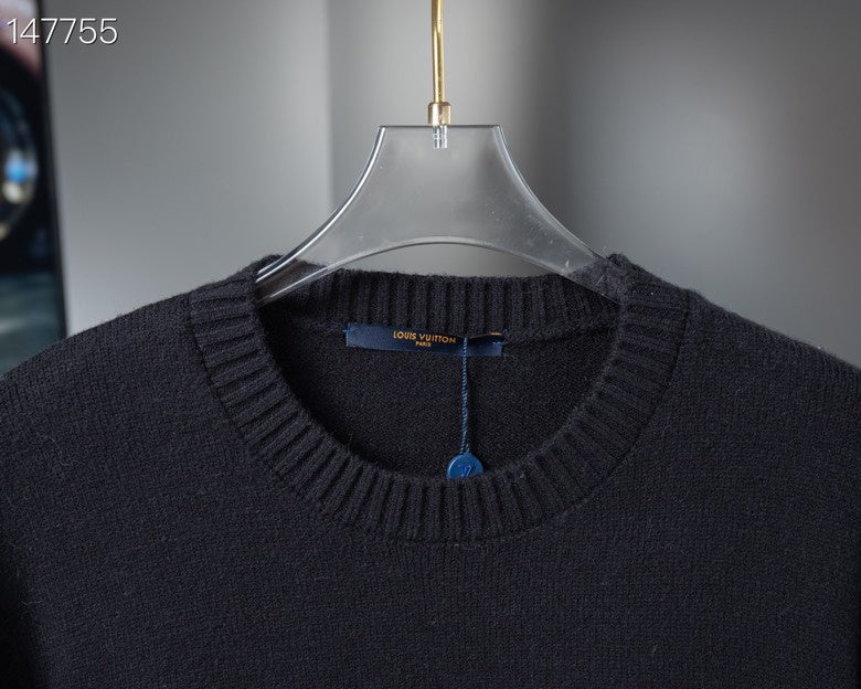 Back view of Louis Vuitton luxury clothing with signature branding