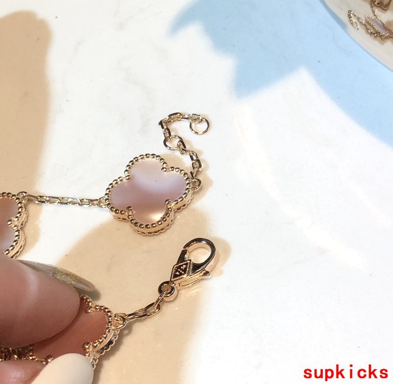 Side view of Van Cleef & Arpels unisex jewelry piece