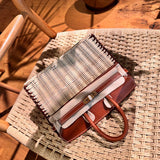 Side view of fluid structured handbag