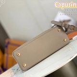 Handle and strap detail of classic polished women's handbag – women's everyday handbag