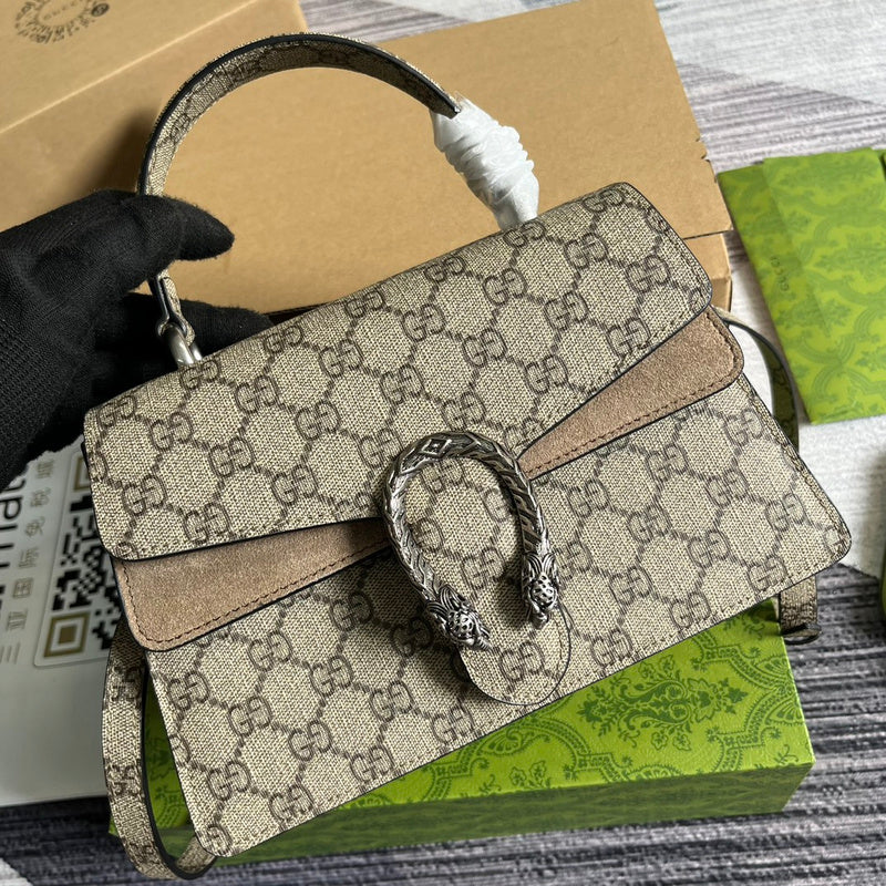 Handle and strap detail of chic polished women's handbag – women's designer-style accessory