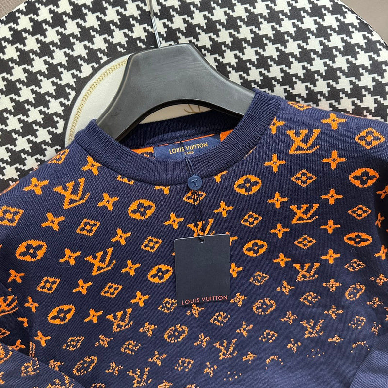 Close-up detail shot of Louis Vuitton luxury clothing with label-forward styling
