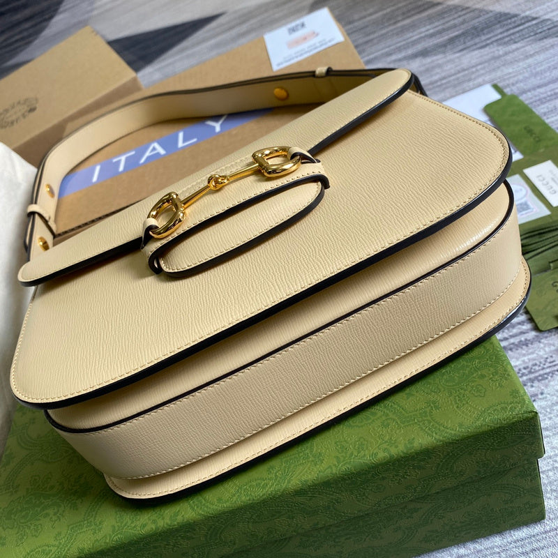 Handle and strap detail of refined polished women's handbag – women's designer-style accessory