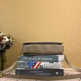 Styled lifestyle shot of classic signature women's handbag – women's luxury accessory