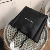 Styled lifestyle shot of sleek premium women's handbag – women's premium purse