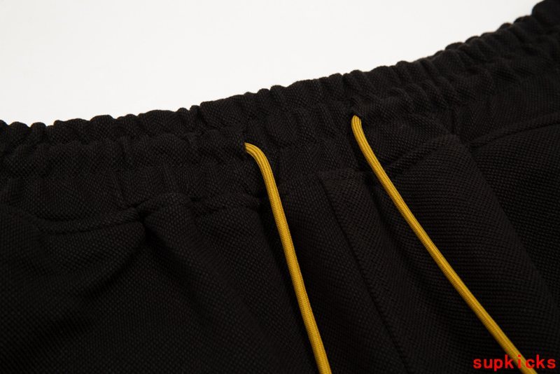 Close-up detail shot of Rhude luxury clothing with contemporary cut