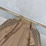 Flat lay presentation of Gucci luxury clothing with monogram-inspired silhouette