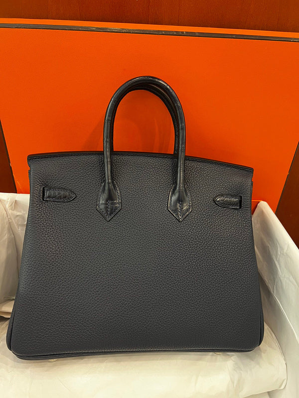Side view of statement structured handbag