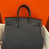 Side view of statement structured handbag
