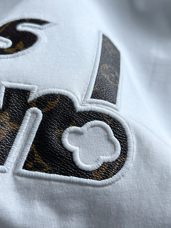 Flat lay presentation of Louis Vuitton cotton t-shirt with relaxed-fit cut