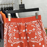 Front view of Rhude luxury clothing with label-forward styling