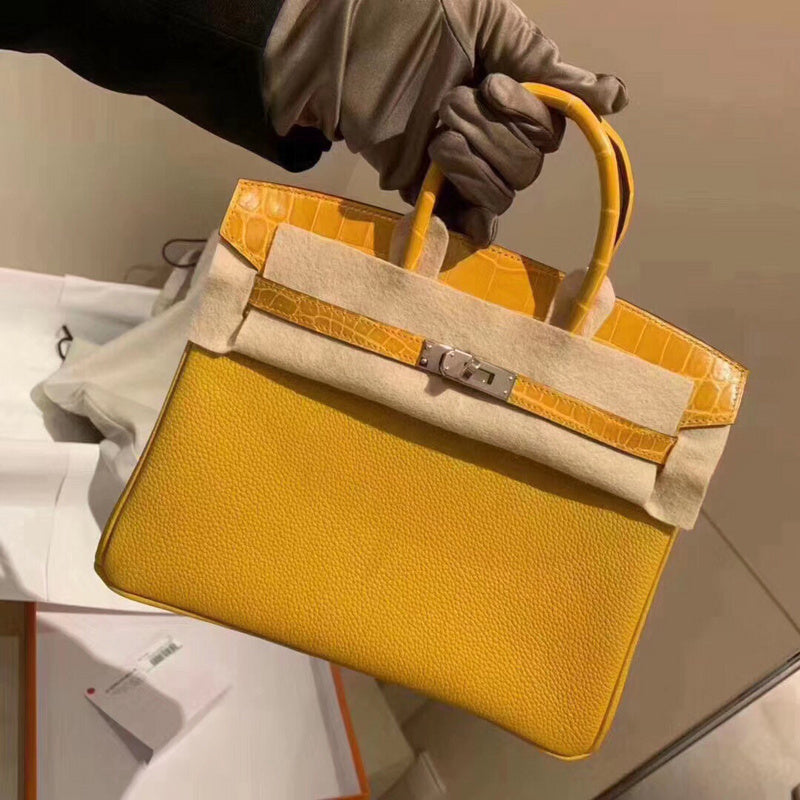 Side view of poised structured handbag