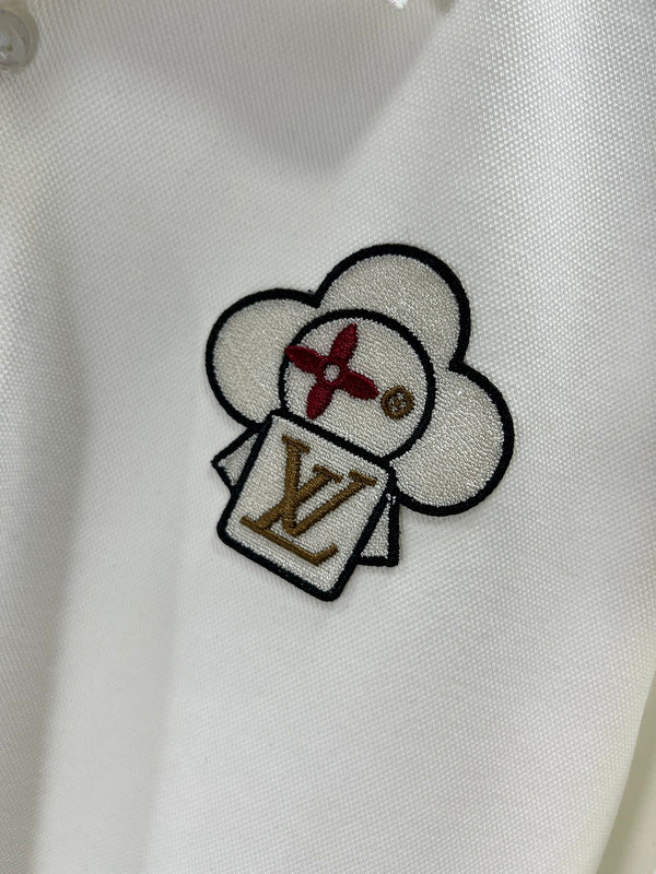 Flat lay presentation of Louis Vuitton luxury clothing with logo-detail design