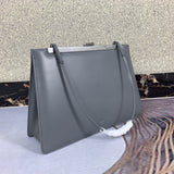 Close-up detail of elevated polished women's handbag – women's statement bag