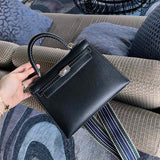 Side view of streamlined structured handbag