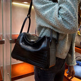 Side view of modern structured handbag