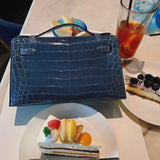 Side view of polished structured handbag