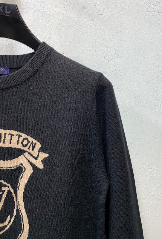 Side profile of Louis Vuitton luxury clothing with label-forward styling