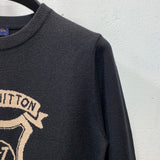 Side profile of Louis Vuitton luxury clothing with label-forward styling