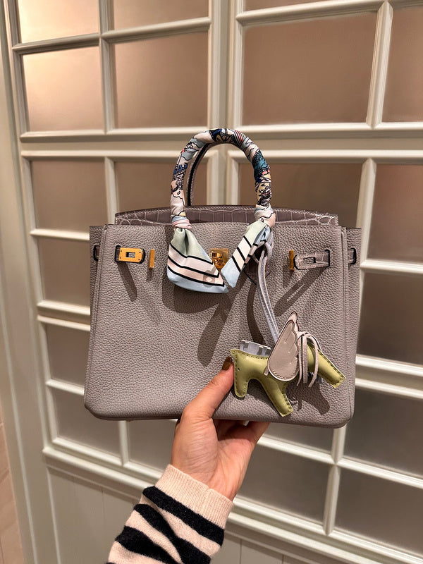 Side view of curated structured handbag