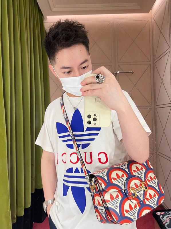 Side profile of Gucci luxury clothing with signature branding