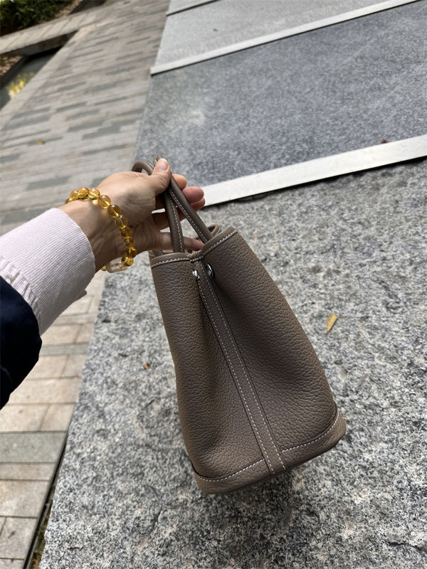 Side view of statement structured handbag