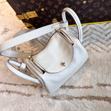 Side view of sleek structured handbag