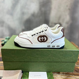 Gucci Designer sneakers in muted earth tones cushioned comfort fit front view