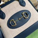 Handle and strap detail of polished structured women's handbag – women's designer-style accessory