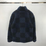 Flat lay presentation of Louis Vuitton luxury clothing with signature branding