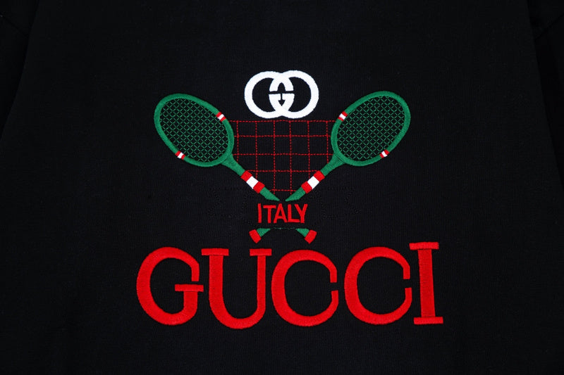 Flat lay presentation of Gucci luxury clothing with contemporary cut