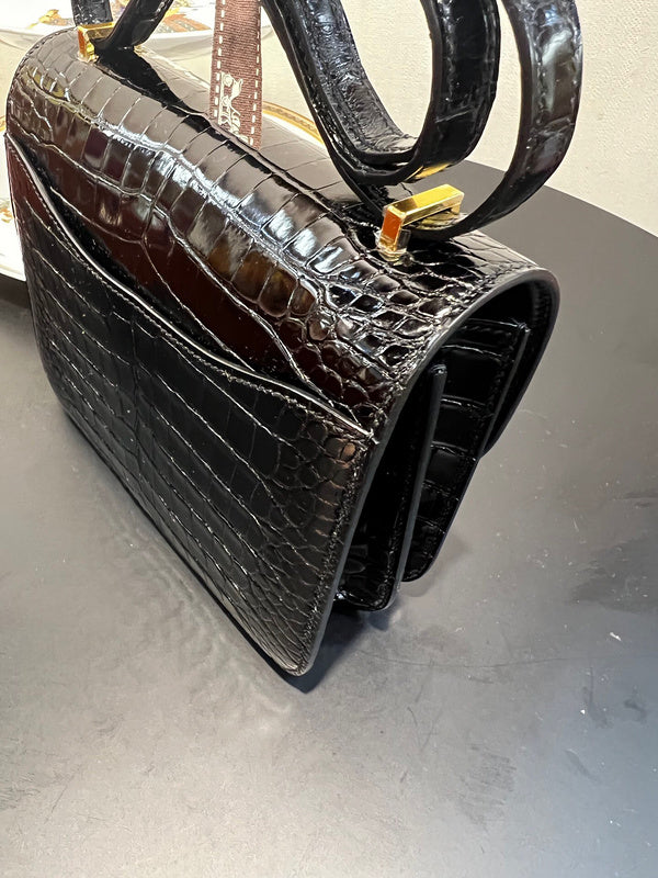 Side view of sleek structured handbag