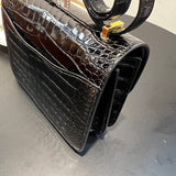 Side view of sleek structured handbag
