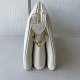 Front view of structured premium women's handbag – women's designer-style accessory