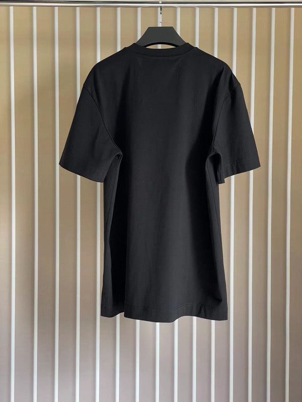 Flat lay presentation of Givenchy luxury clothing with monogram-inspired silhouette