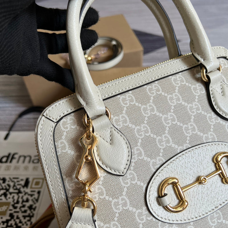 Styled lifestyle shot of signature elevated women's handbag – women's statement bag