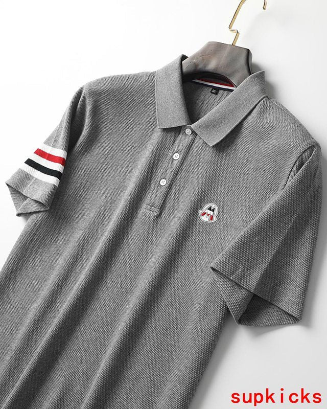 Flat lay presentation of Moncler luxury clothing with contemporary cut
