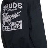 Side profile of Rhude luxury clothing with signature branding