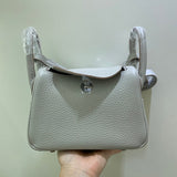 Side view of tailored structured handbag