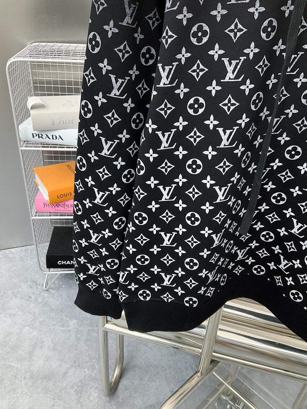 Flat lay presentation of Louis Vuitton luxury clothing with monogram-inspired silhouette