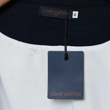 Close-up detail shot of Louis Vuitton luxury clothing with label-forward styling