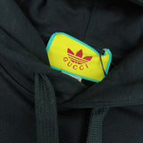 Close-up detail shot of Gucci luxury clothing with monogram-inspired silhouette