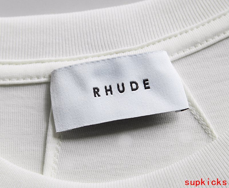 Flat lay presentation of Rhude luxury clothing with contemporary cut