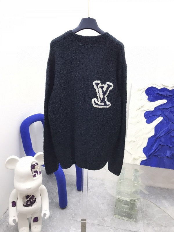 Back view of Louis Vuitton luxury clothing with label-forward styling