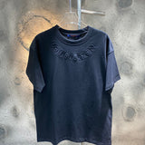 Close-up detail shot of Louis Vuitton cotton t-shirt with runway-inspired design